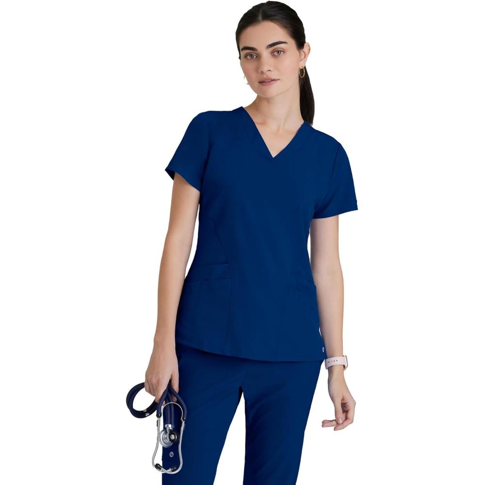 imageBARCO ONE Womens Pulse Scrub Top Sporty VNeck Medical Top w 4Way Stretch amp 5 PocketsIndigo Navy