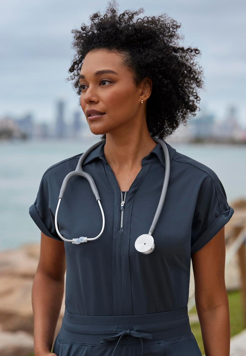 imageBARCO One Performance Knit Engage Classic Fit Scrub Top for Women 2Pocket Zip Neck Collar Shirt with 360 Spandex StretchIndigo